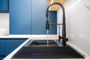 Black workstation sink with tall spring pull down faucet