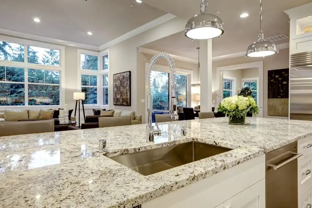 Bright kitchen with polished granite island countertop