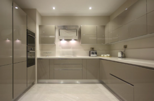 Glossy beige modern kitchen with sleek cabinet doors