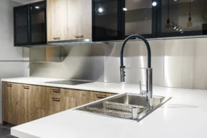 Modern kitchen with stainless steel drop in sink and sprayer