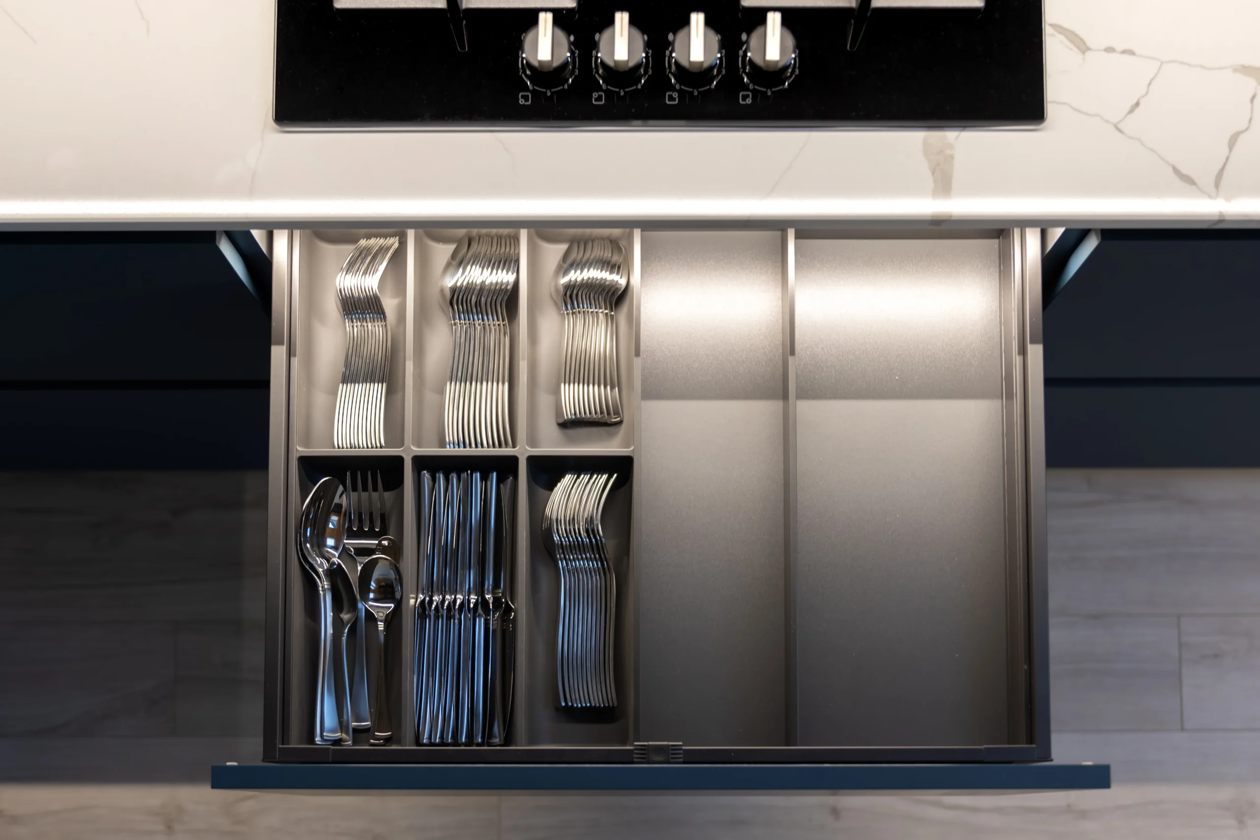 Organized kitchen drawer showing cutlery layout