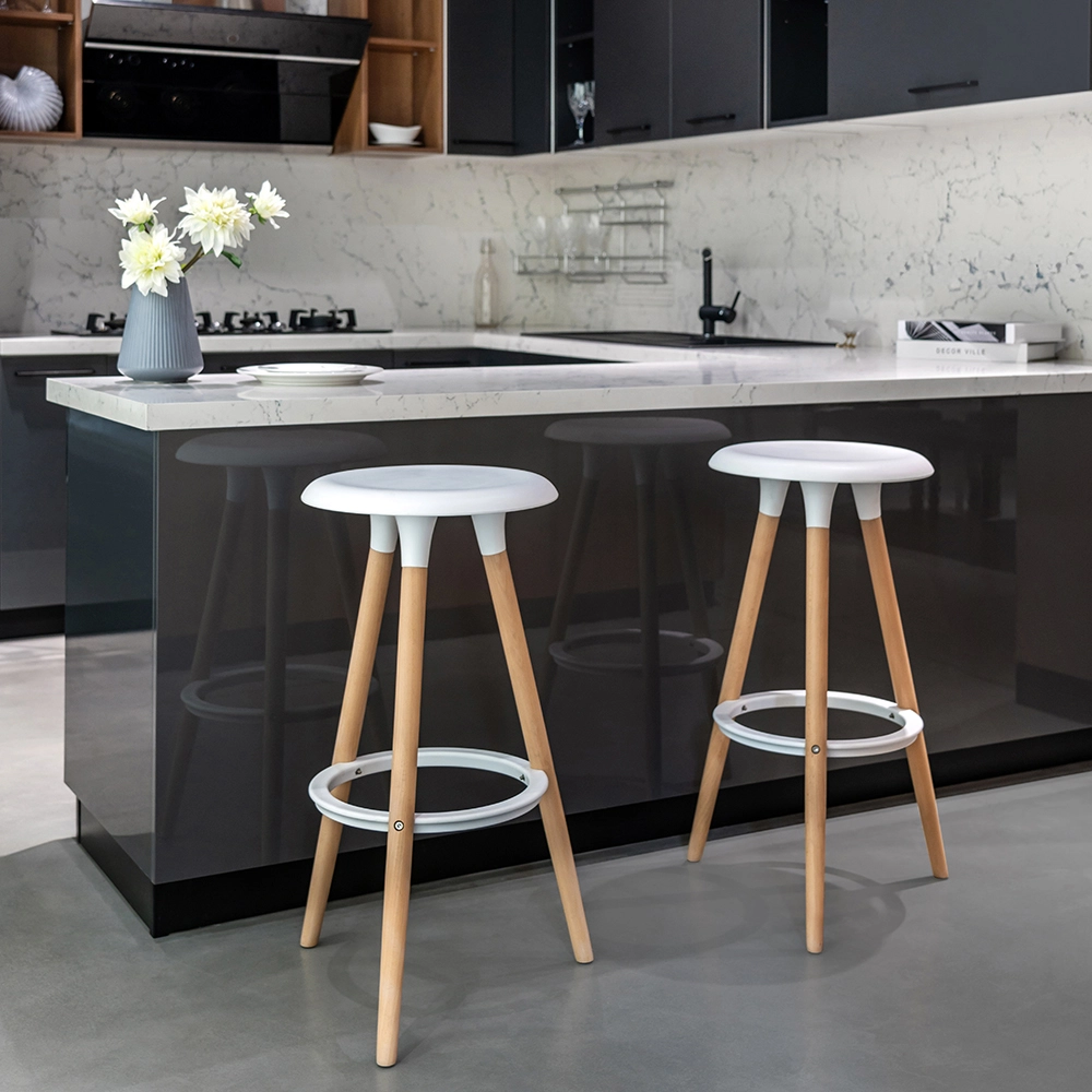 Stylish kitchen island with white stools and grey finish
