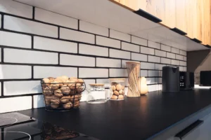 White subway tile backsplash with dark grout lines
