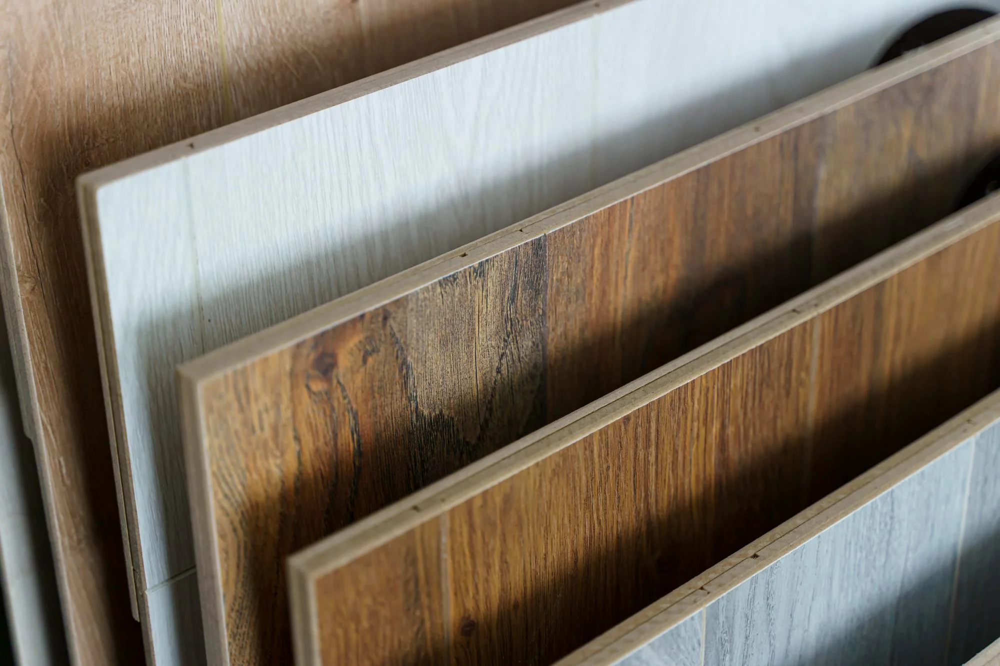 Wood look cabinet board samples in multiple colours