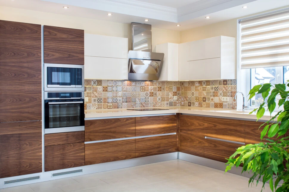 Wood veneer cabinets with patterned tile backsplash