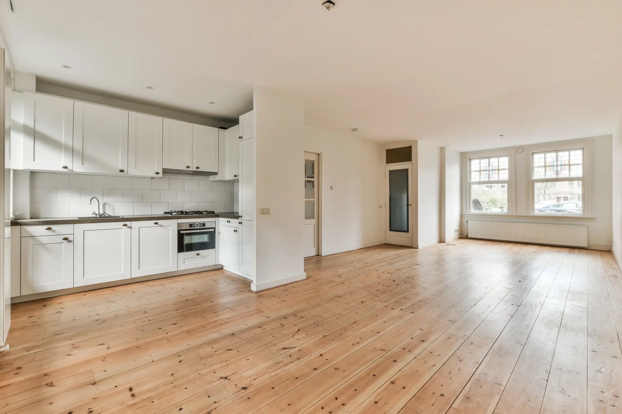 Bright kitchen interior with hardwood floor and island