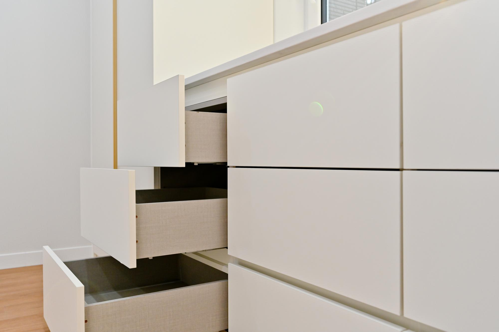 Contemporary white dresser with open drawers Contemporary white dresser with open drawers