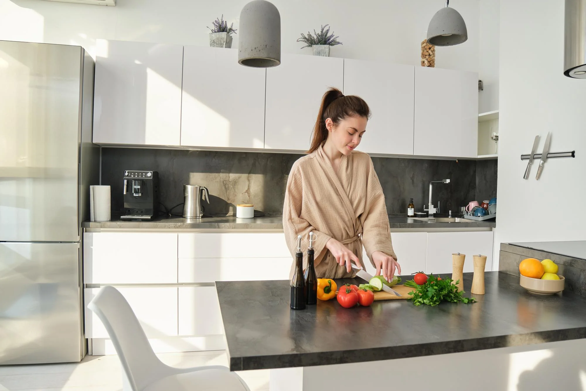 Minimalist kitchen island with prep space and pendant lights
