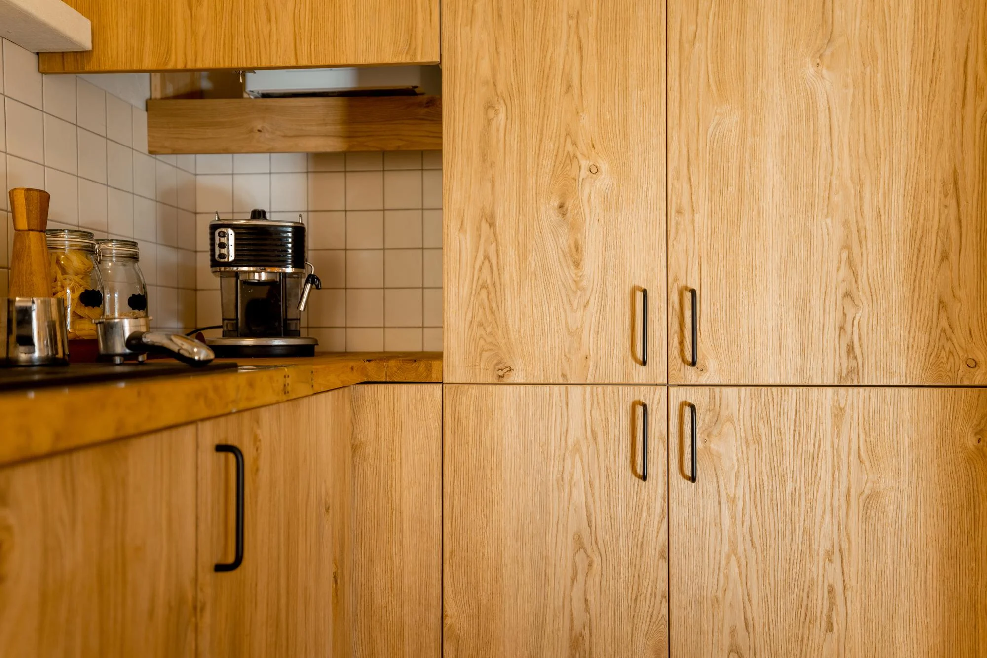 Natural wood kitchen cabinets with warm grain texture