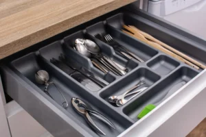 Organized kitchen drawer with cutlery and utensil inserts