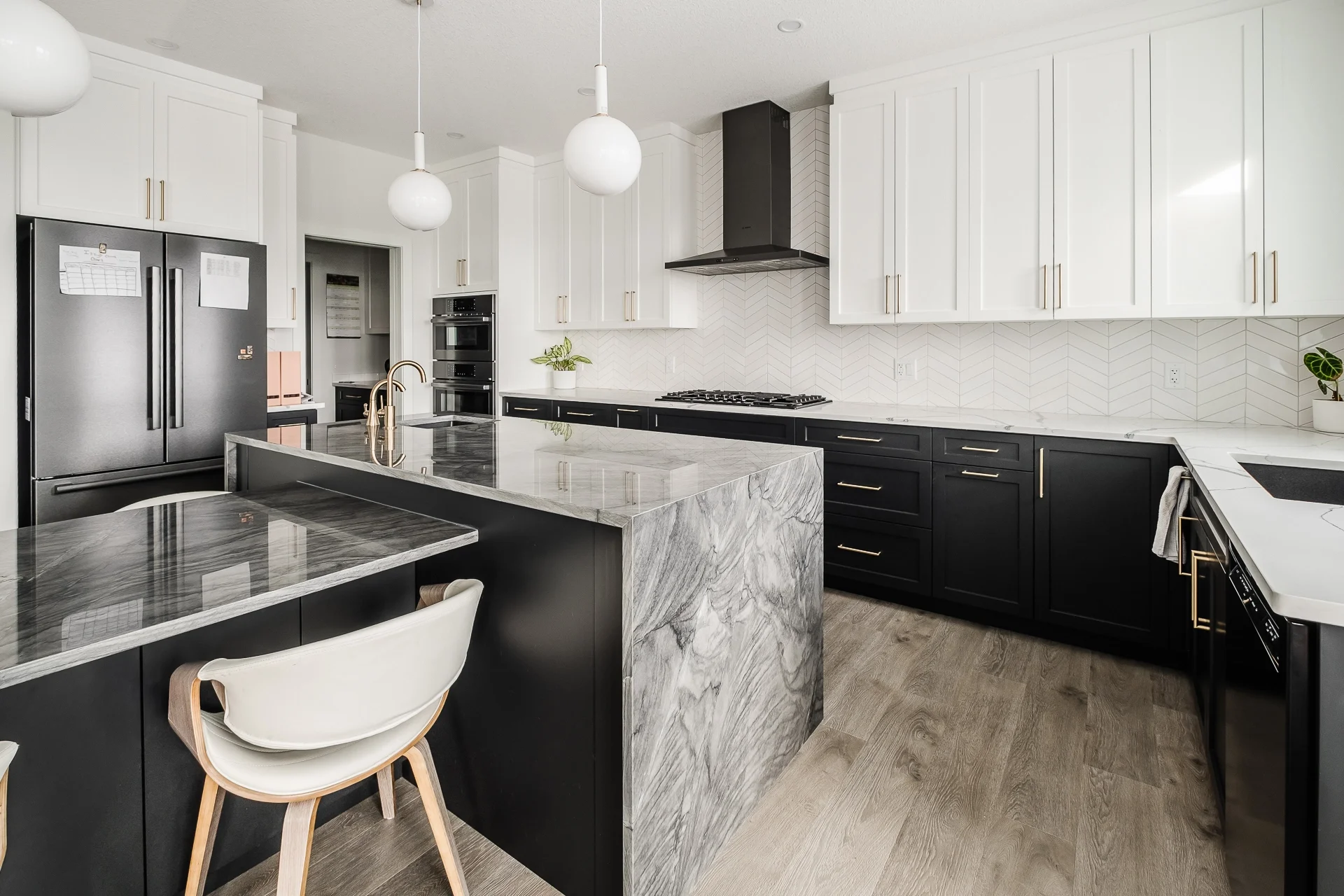 Waterfall edge kitchen island with marble surface