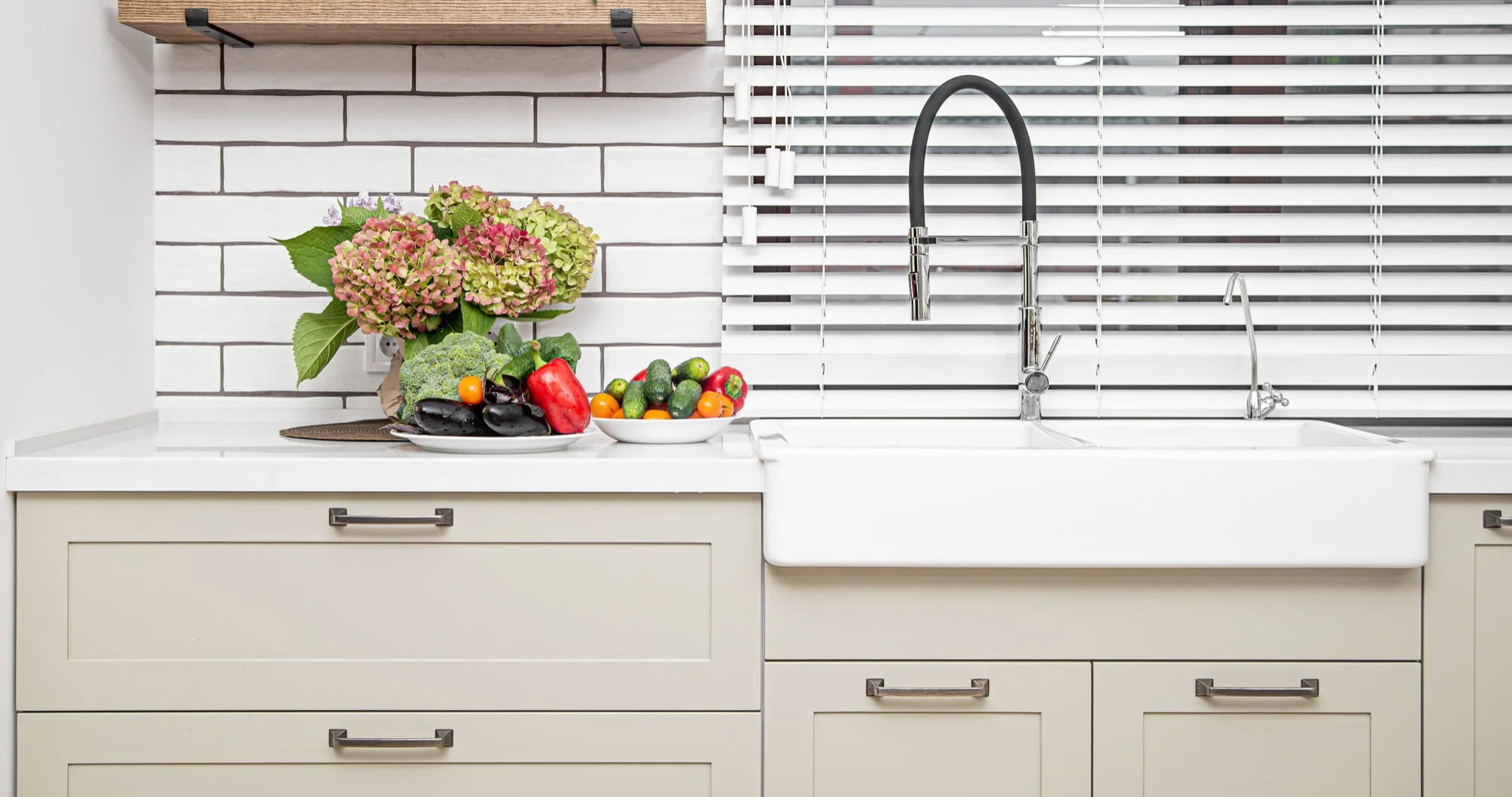 White undermount farmhouse kitchen sink setup