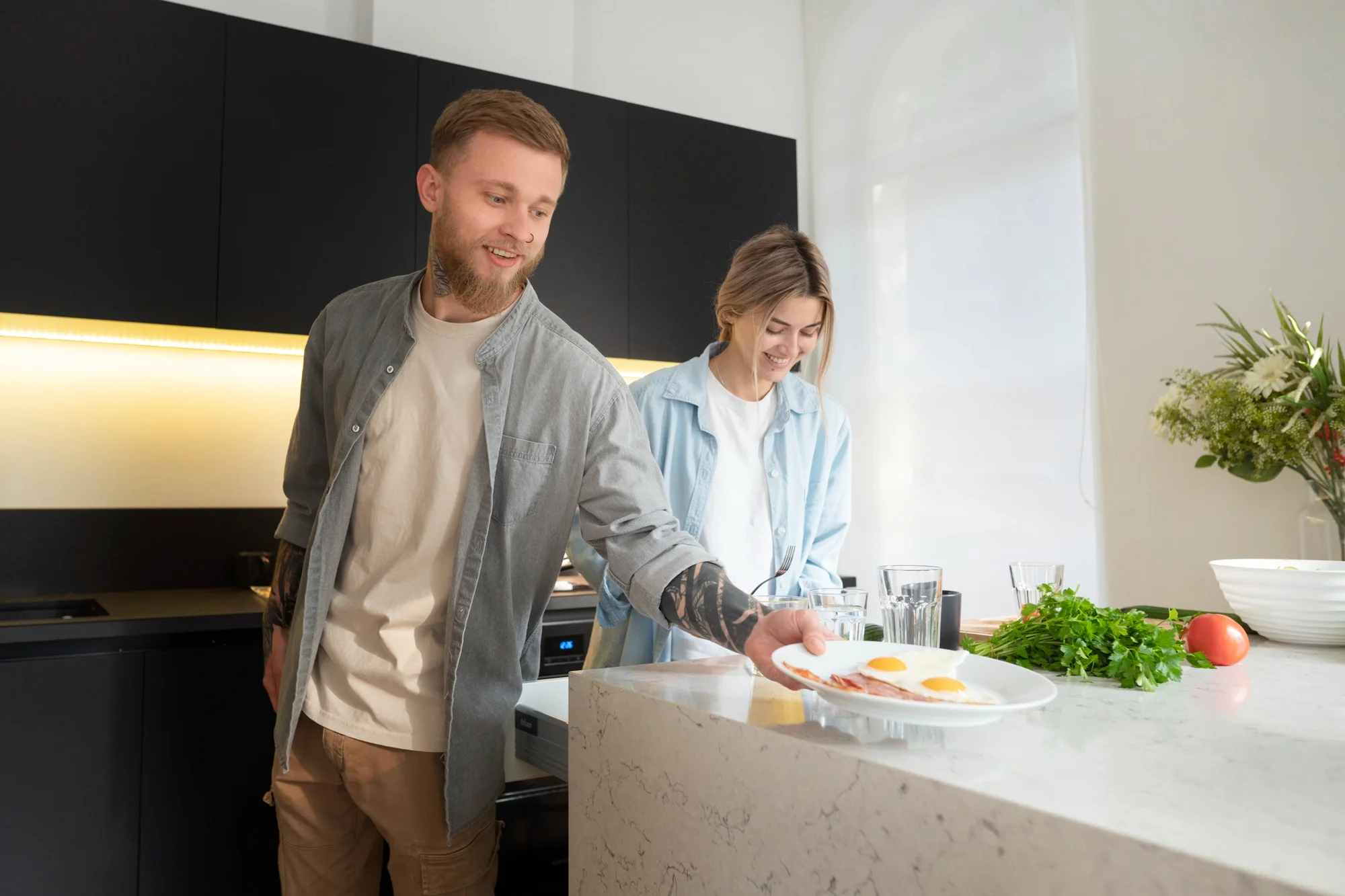 Couple preparing breakfast on a white marble island