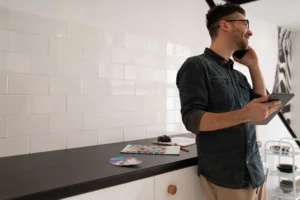 Designer selecting finishes in a minimalist kitchen