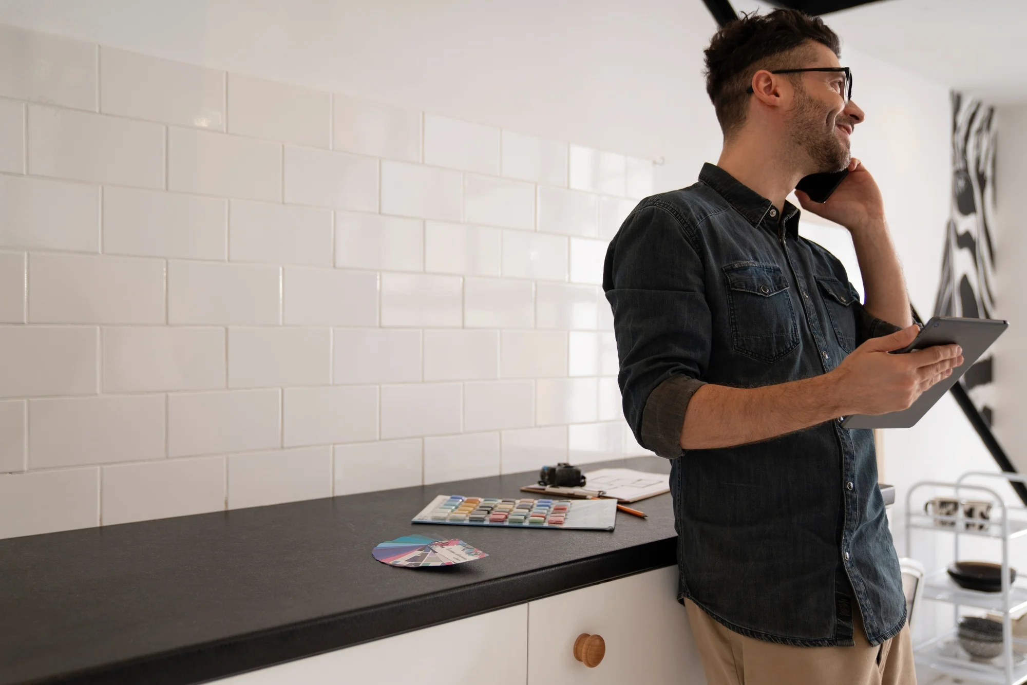 Designer selecting finishes in a minimalist kitchen