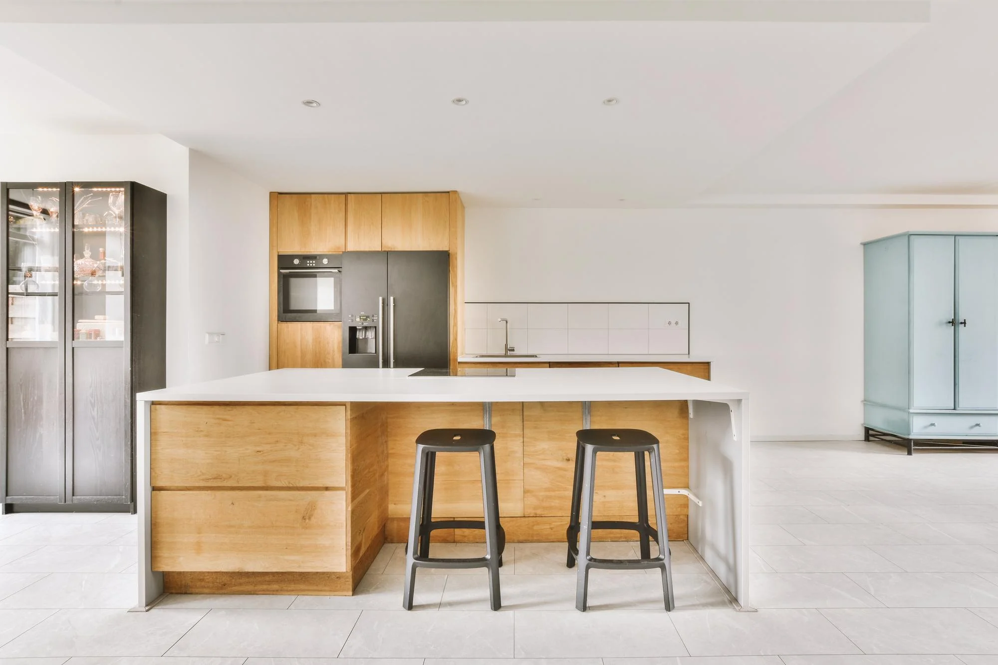 Contemporary white kitchen island with bar seating Contemporary white kitchen island with bar seating