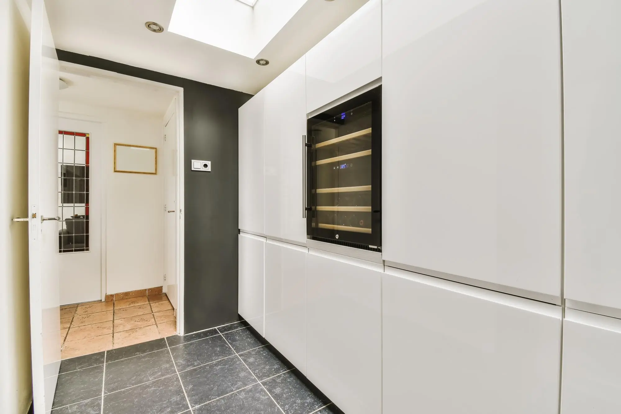 Minimalist frameless kitchen cabinets with wine cooler