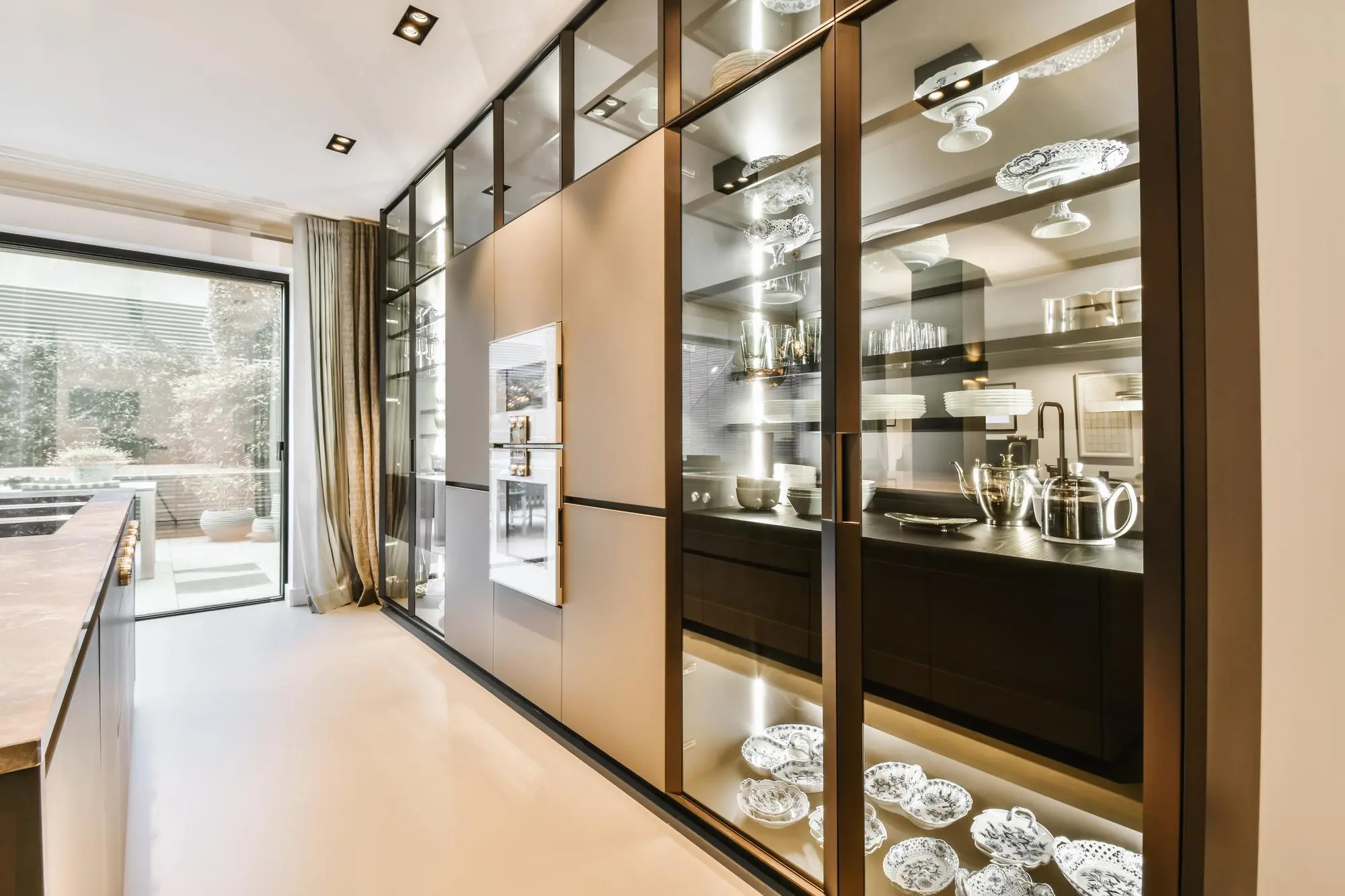 Modern kitchen with glass front display cabinets
