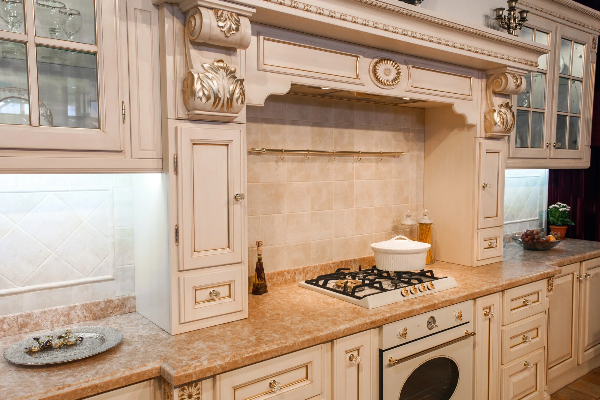 Traditional luxury kitchen cabinetry with ornate hood