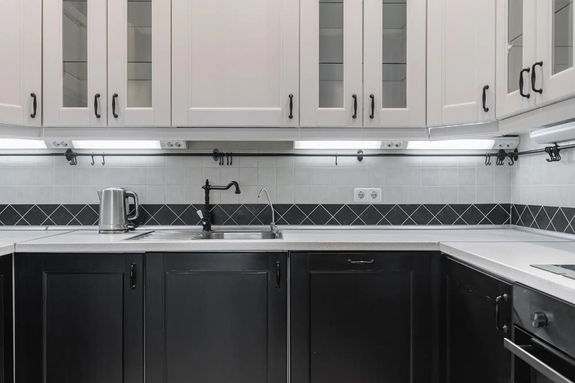 Black and white kitchen with contrasting hardware