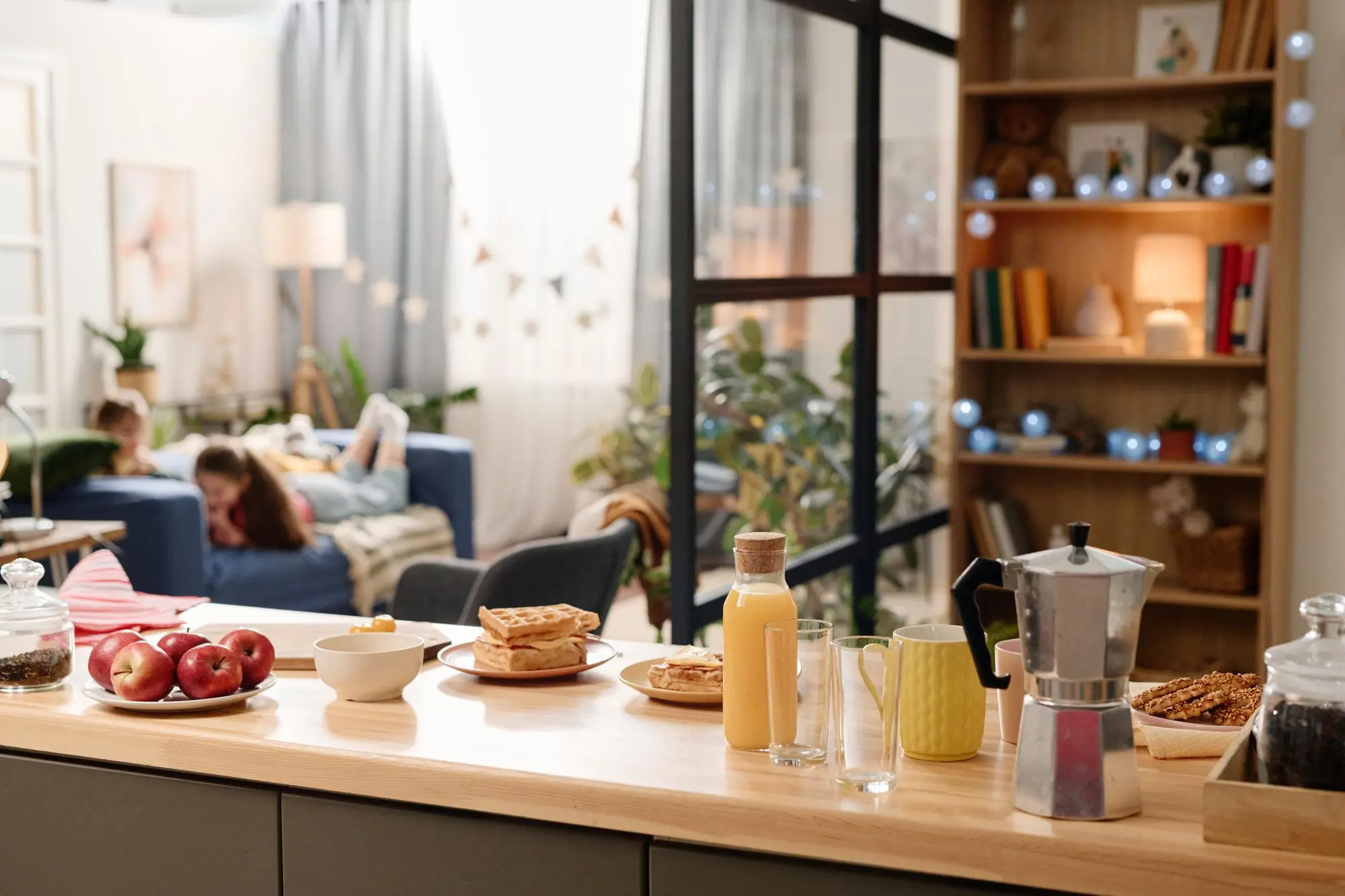 Kitchen island setup with breakfast food and coffee maker