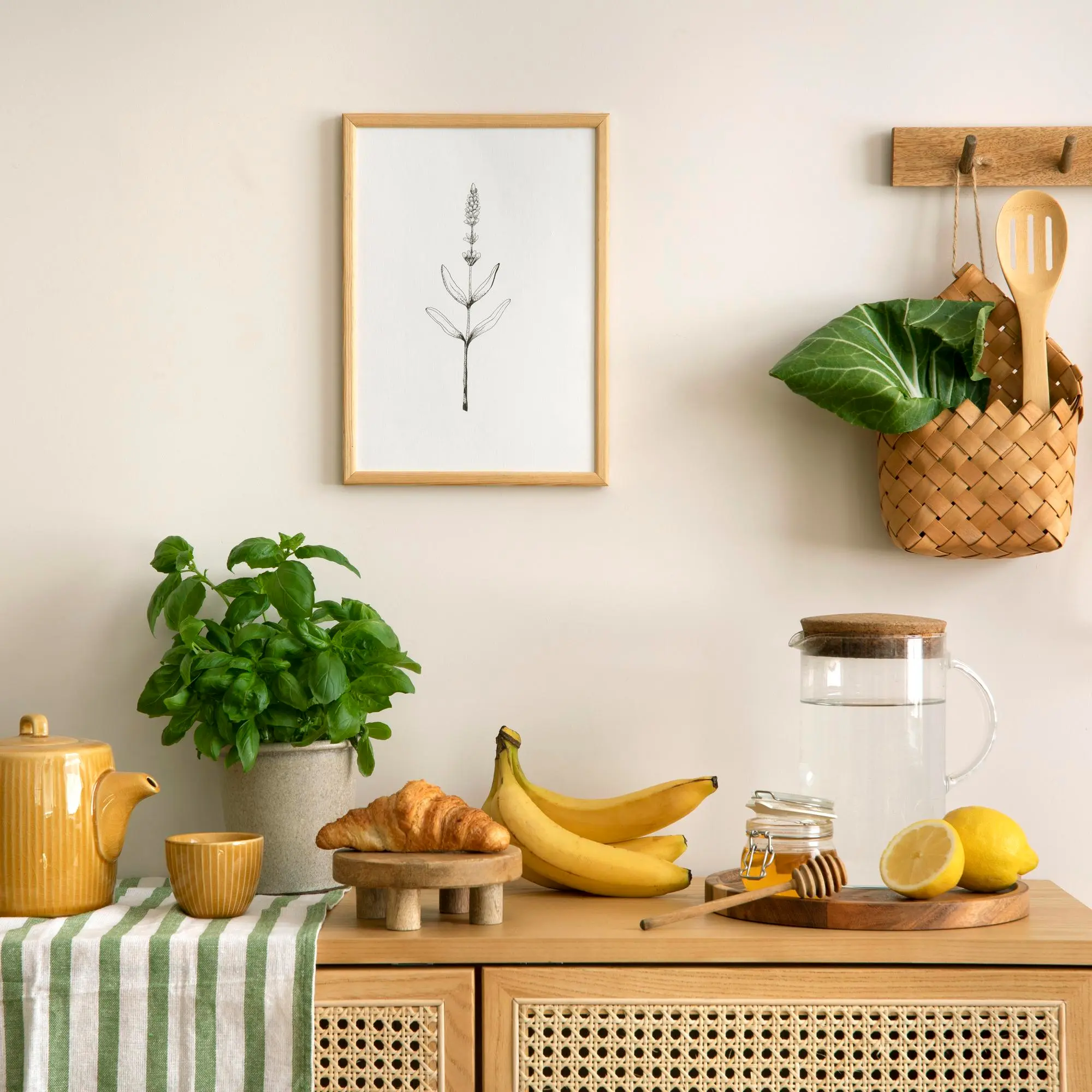 Minimalist kitchen shelf with plants, fruit, and tea set