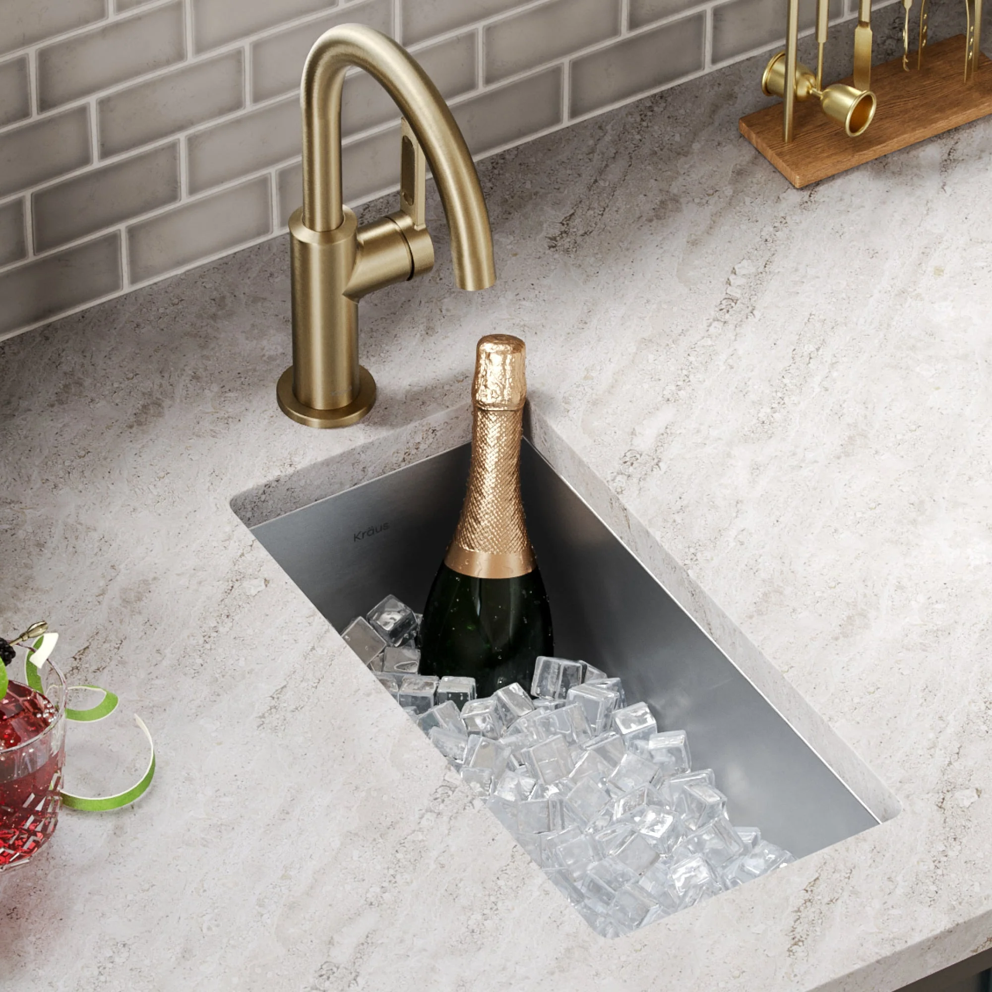 Modern undermount sink with gold faucet and ice bucket