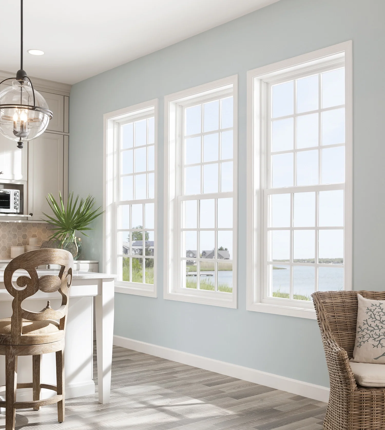 Bright kitchen with tall white single hung windows