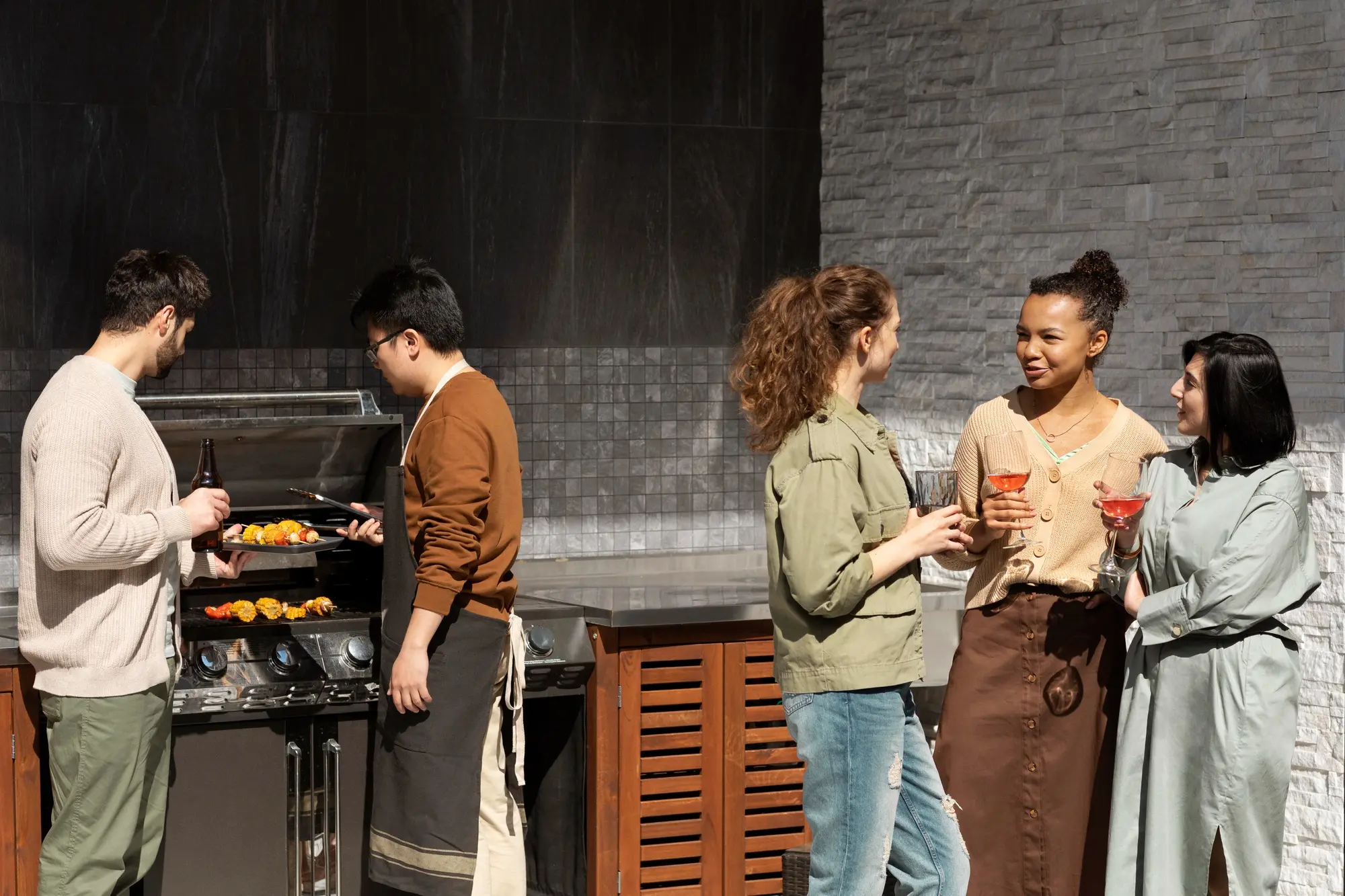 Diverse group of friends enjoying a backyard barbecue, Open Concept Outdoor Kitchen