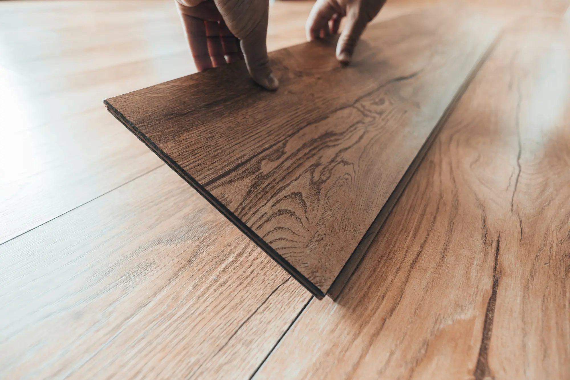 Installing wood look laminate flooring planks indoors Installing wood look laminate flooring planks indoors