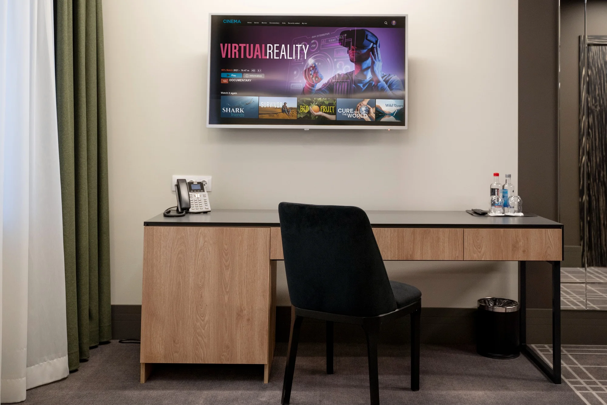 Minimalist workspace with TV, desk, and chair