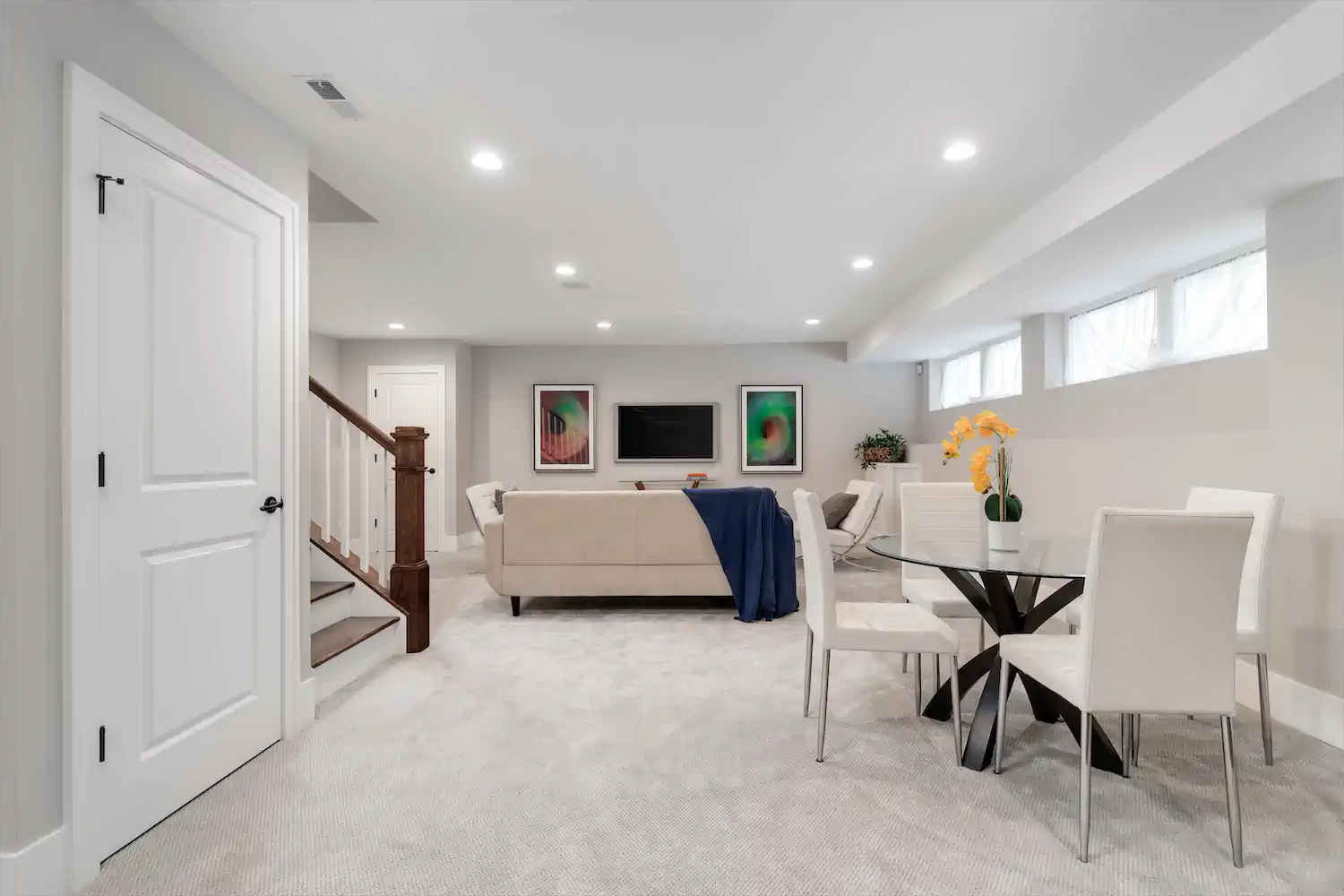 Modern basement living room with horizontal hopper windows