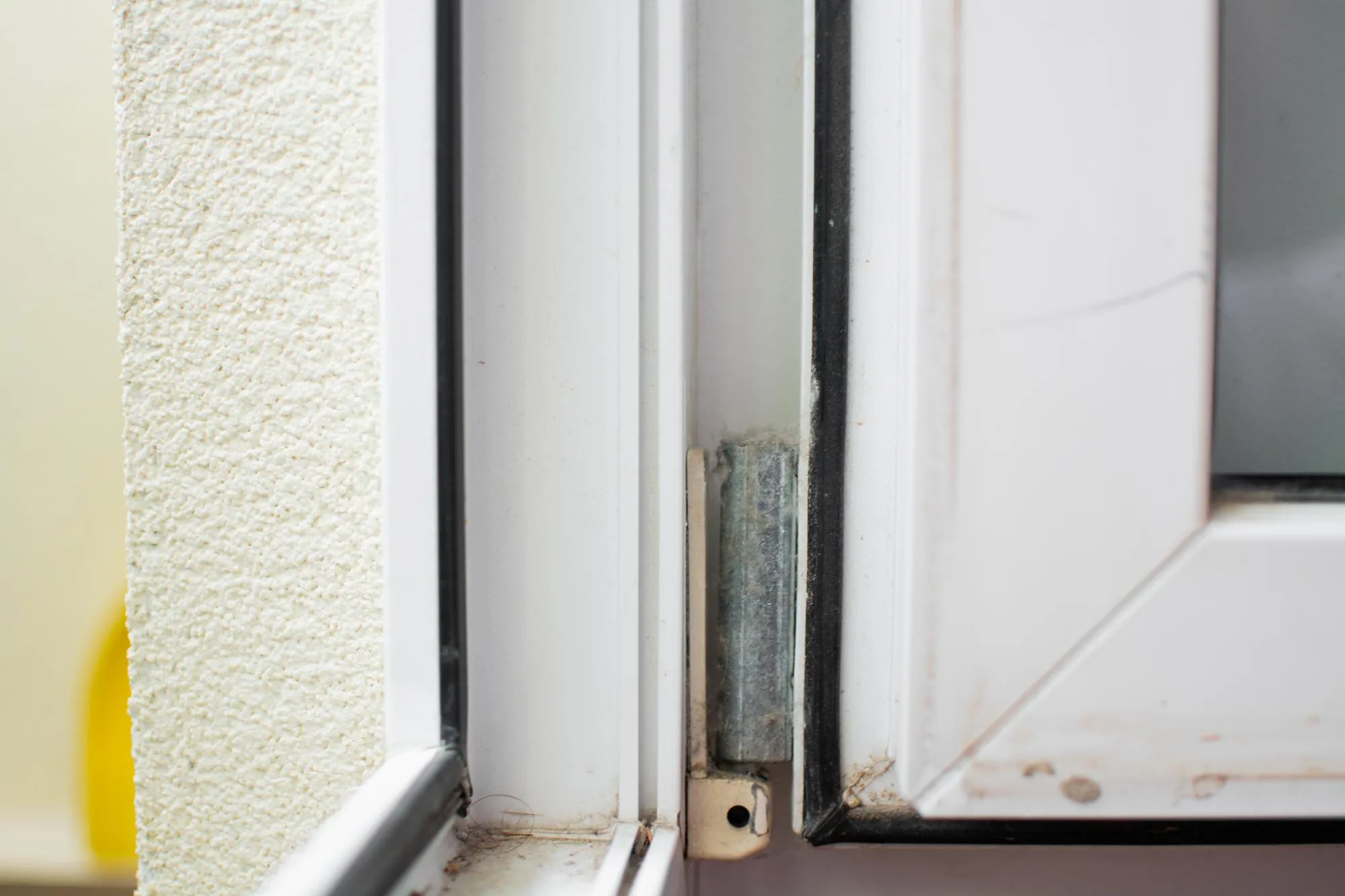 Close up of window frame with drafts and air leaks visible Close up of window frame with drafts and air leaks visible