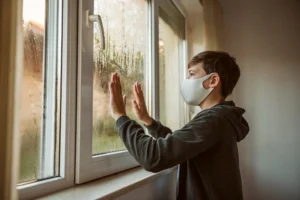 Condensation forming on a window with blurred view outside