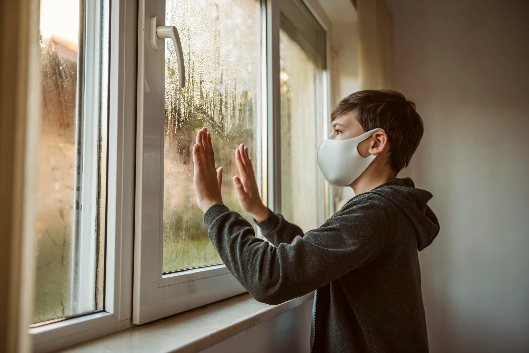 Condensation forming on a window with blurred view outside