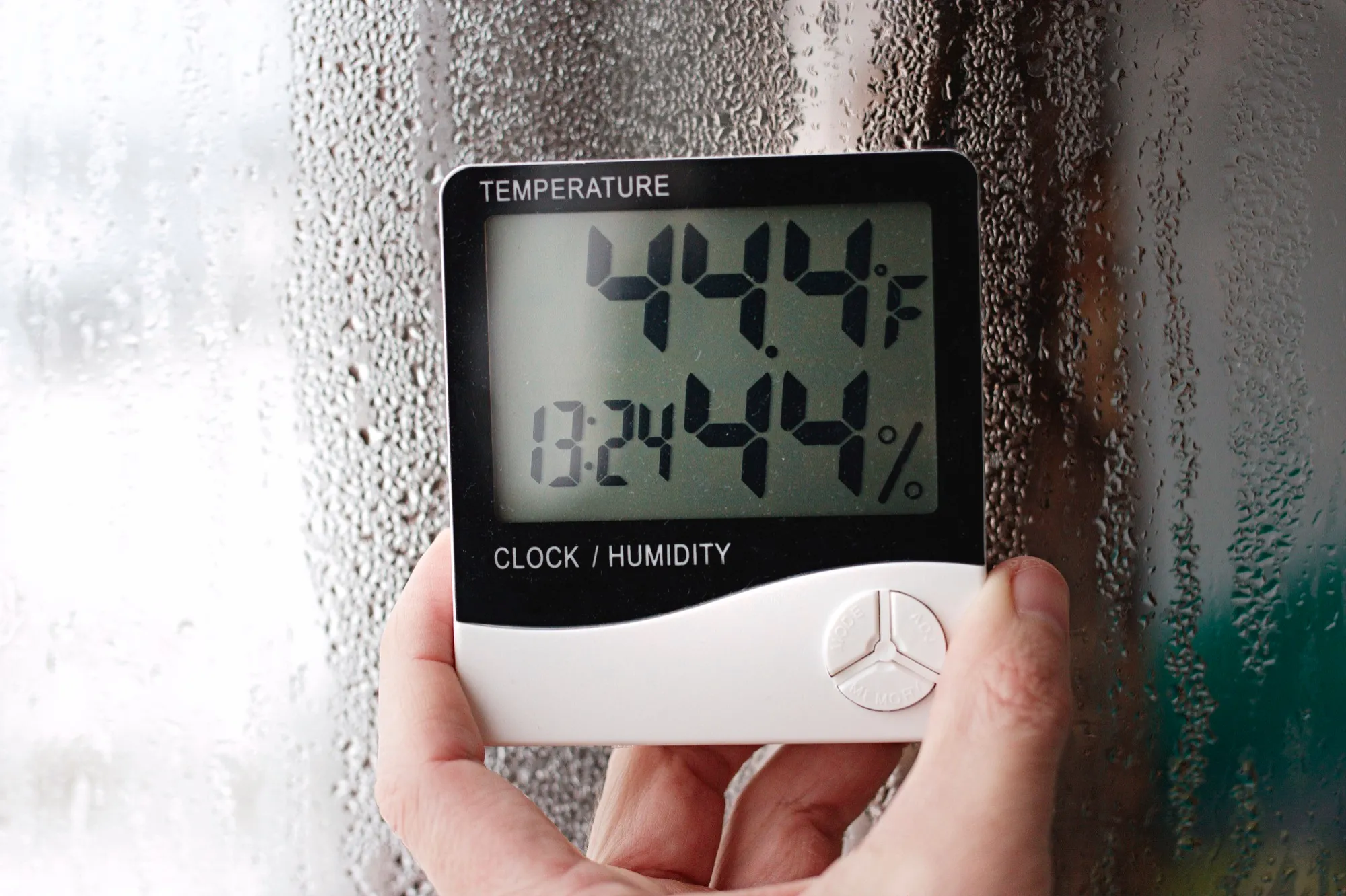 Digital hygrometer shows high humidity causing window condensation Digital hygrometer shows high humidity causing window condensation