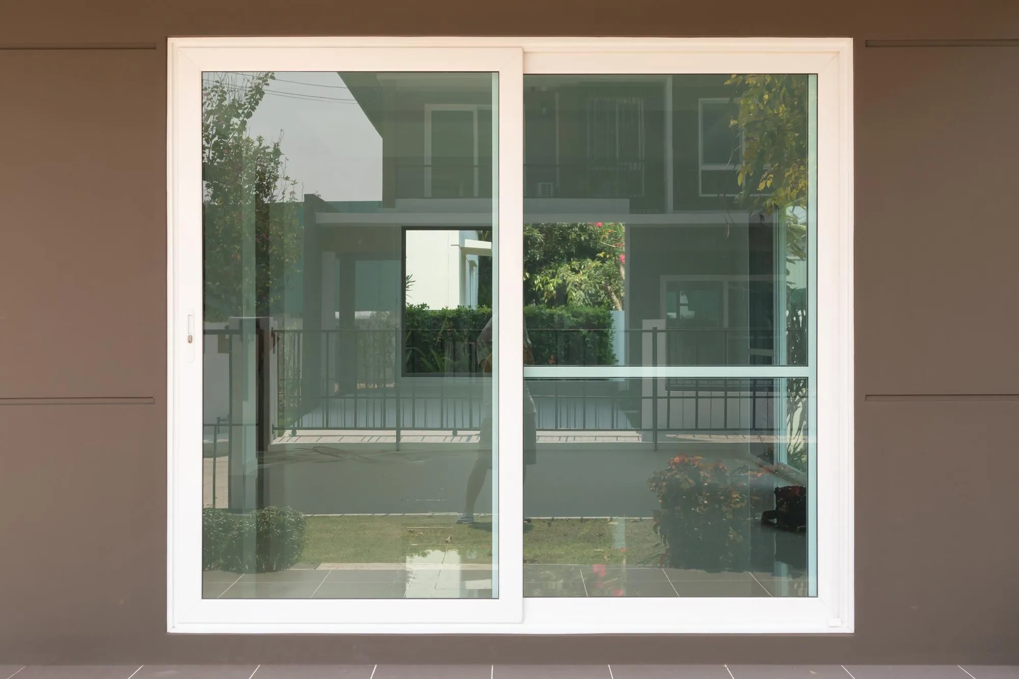 White vinyl sliding window for modern patio entrance White vinyl sliding window for modern patio entrance
