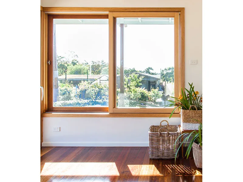 Wood frame sliding window with natural interior finish Wood frame sliding window with natural interior finish